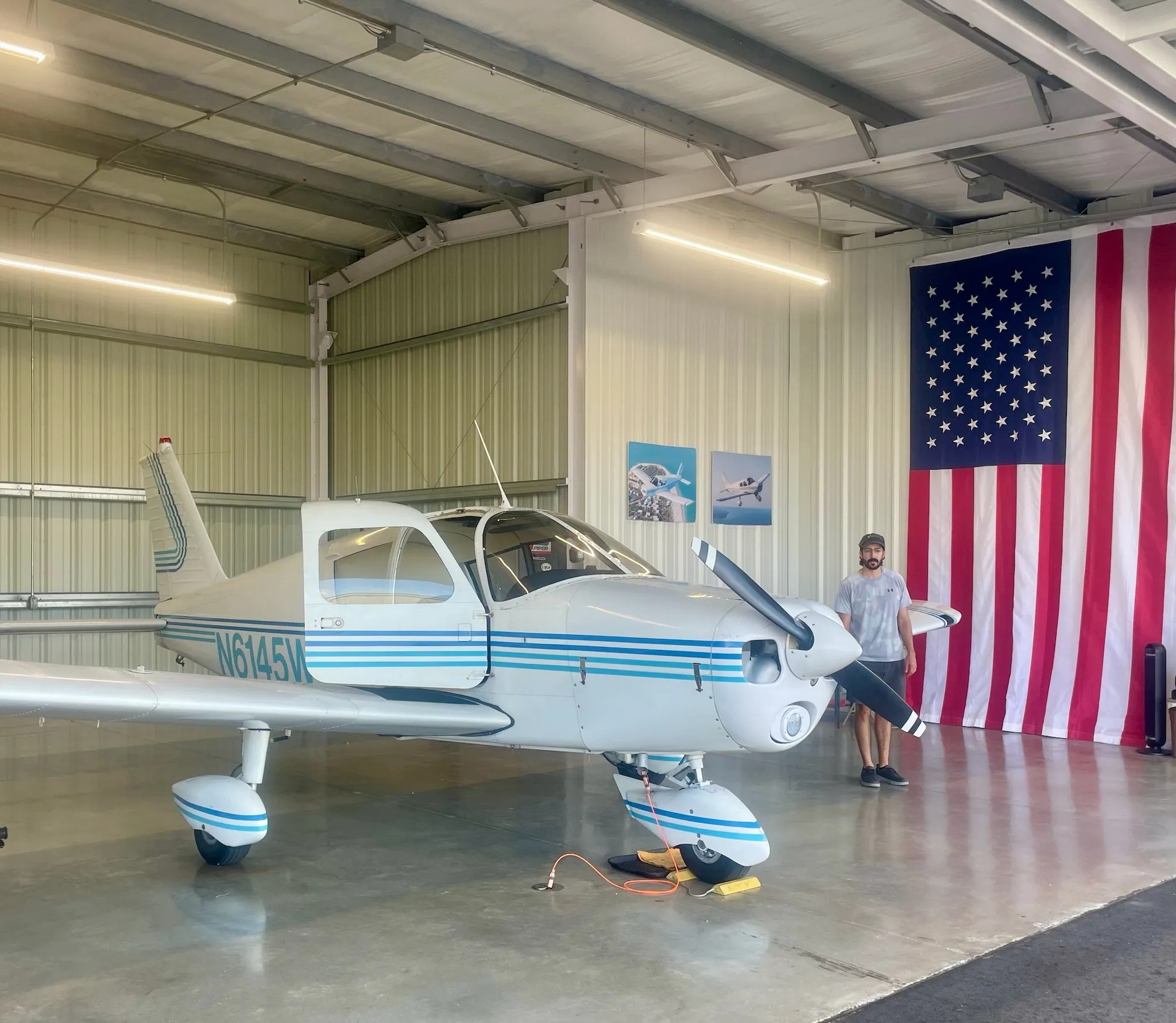 Piper Cherokee 140 in the hangar at Page Field, Fort Myers