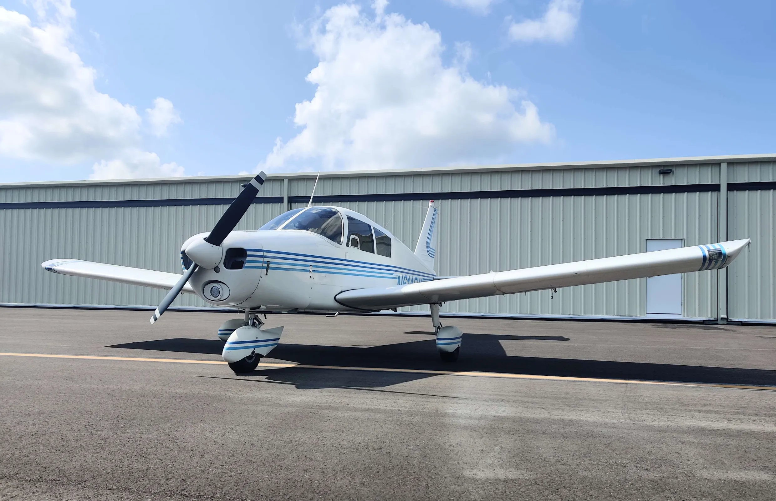 Piper Cherokee 140 on the ramp at Page Field, Fort Myers